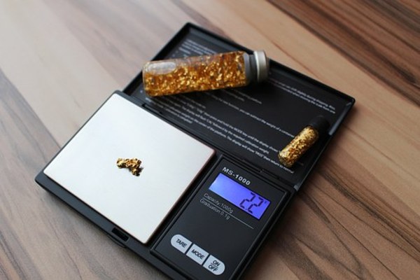 Scale weighing gold.